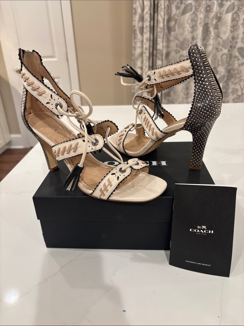 Coach Ivory and Black Studded Tassel High Heel Sandals